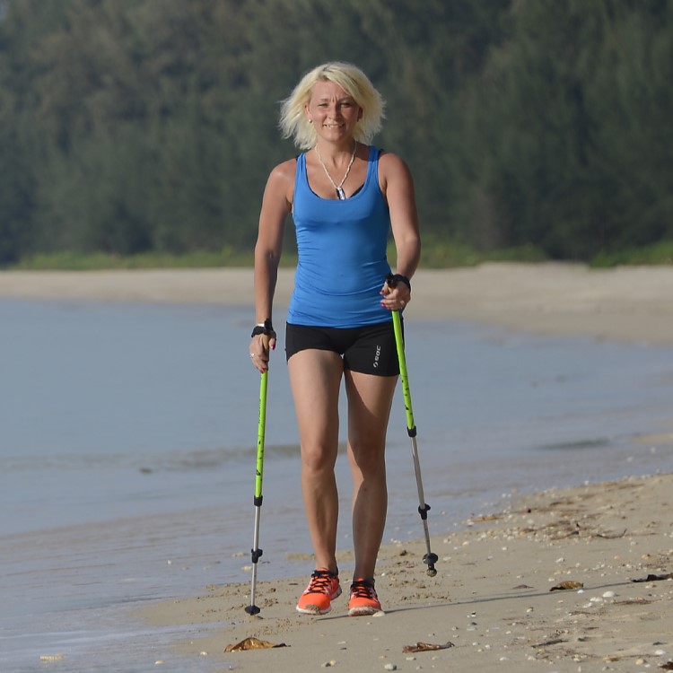 Nordic walking poles with suspension