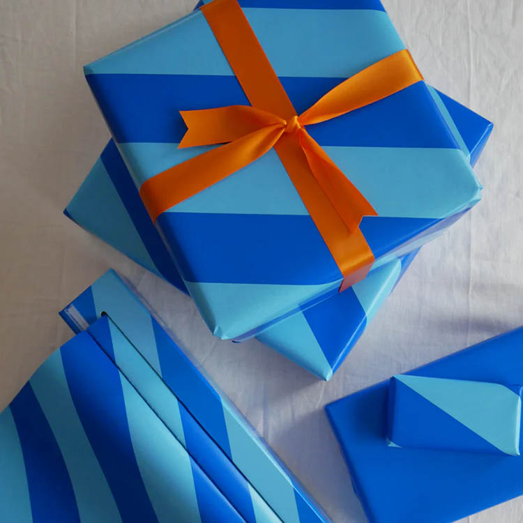 Gift wrap in box with cutting blade