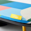 Foldable ironing board with iron storage